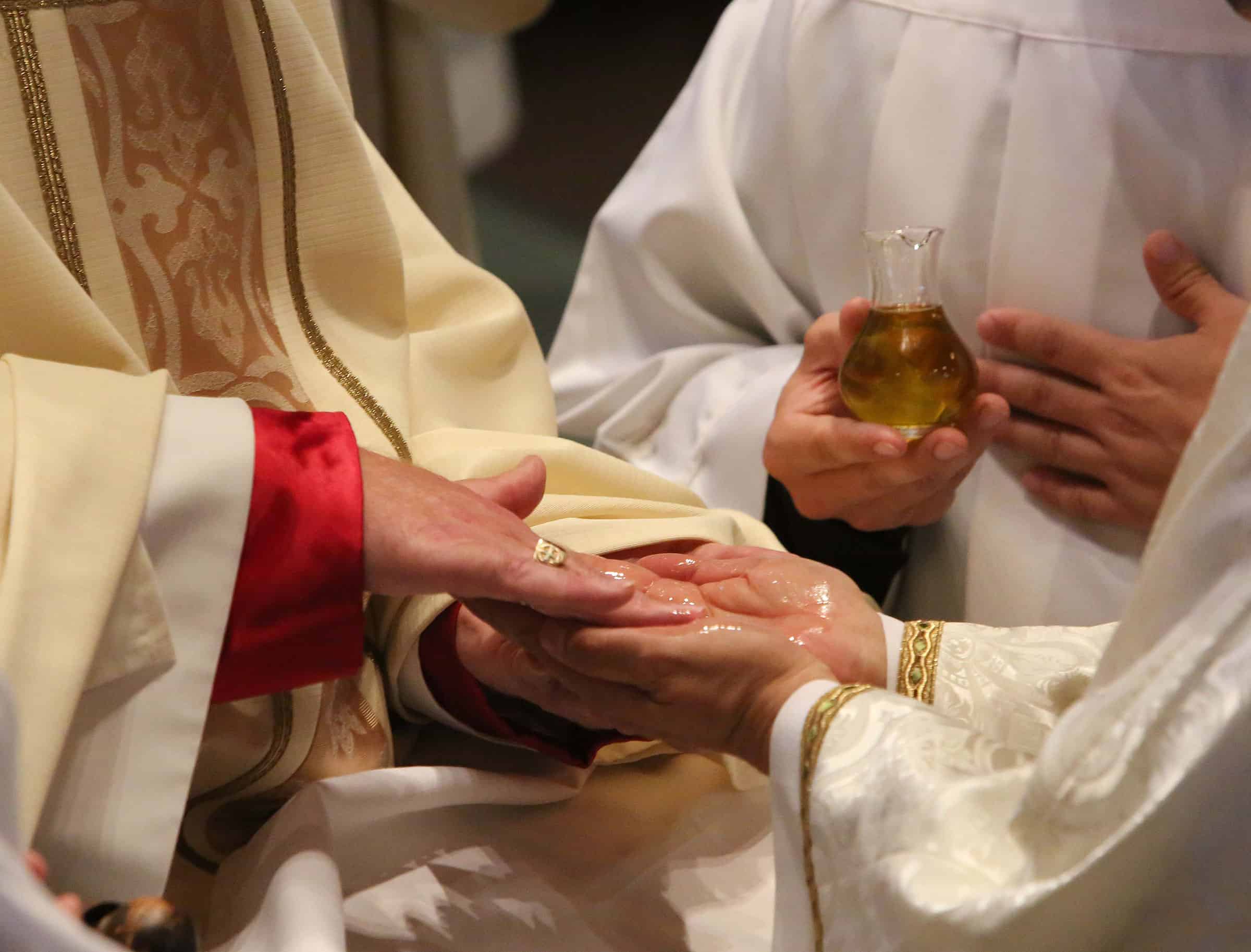 Laying on of hands catholic